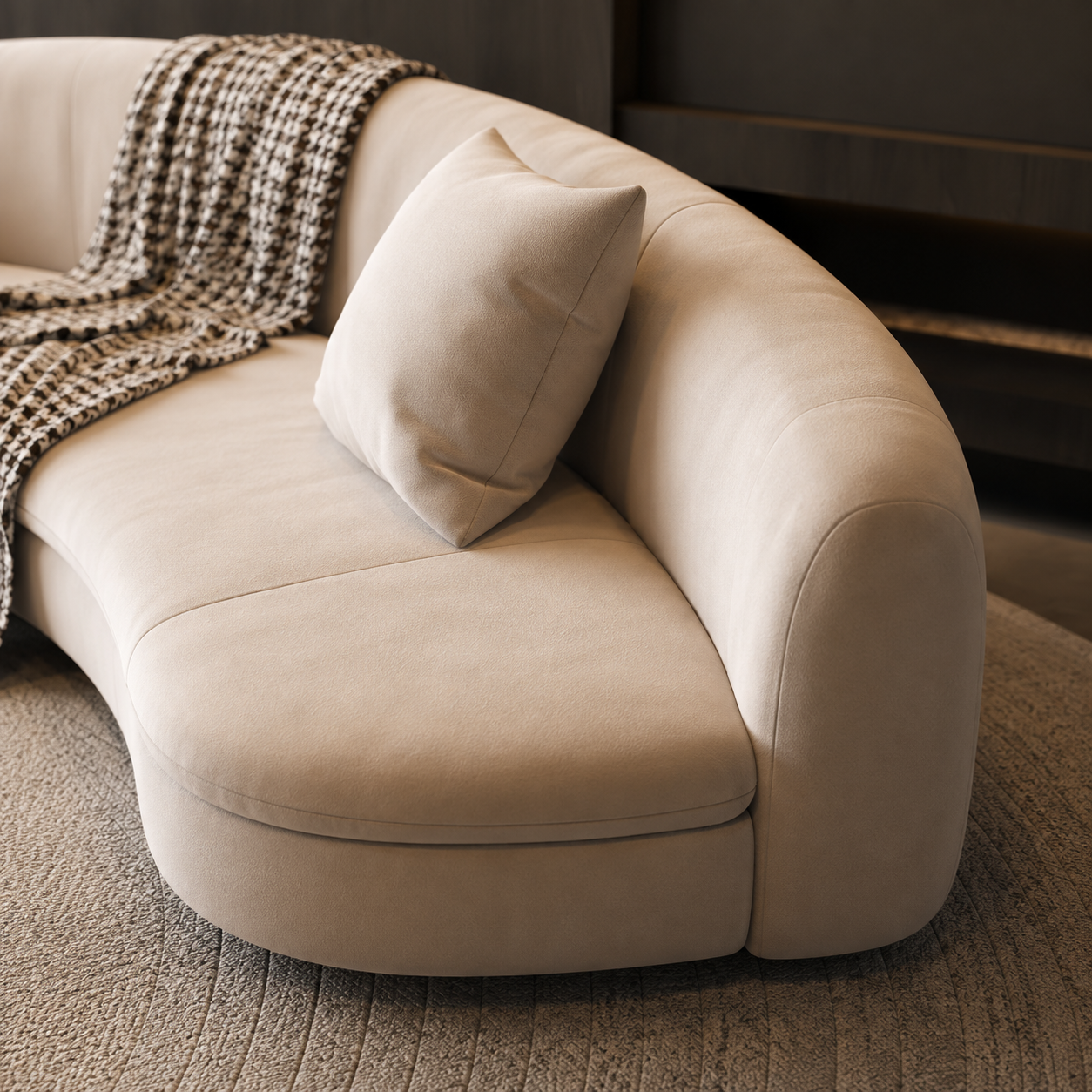 Close view of the Abside Sofa end, the back rolling away to nothing over the curved plinth