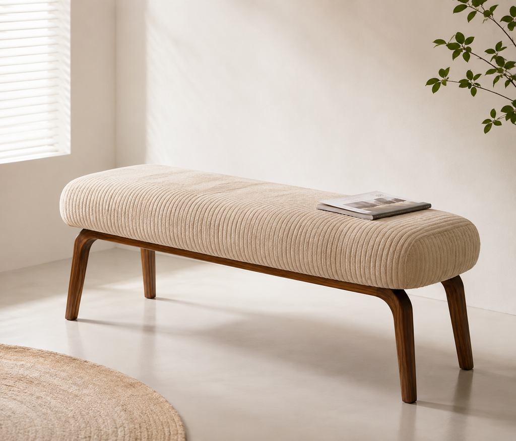 Amance Bench seen from the side, the ribs running across the seat and the walnut legs splaying outward