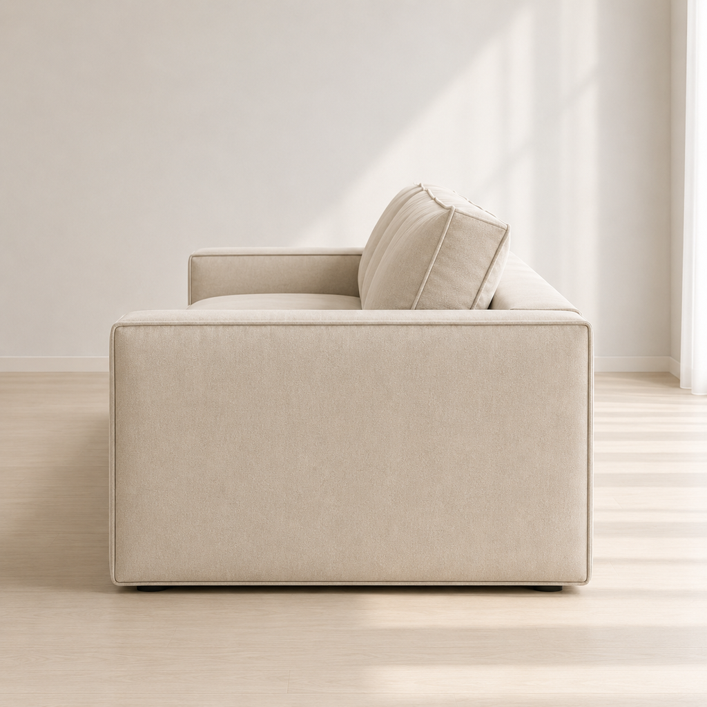 Ample Sofa from the side, showing the depth of the arm and the low base