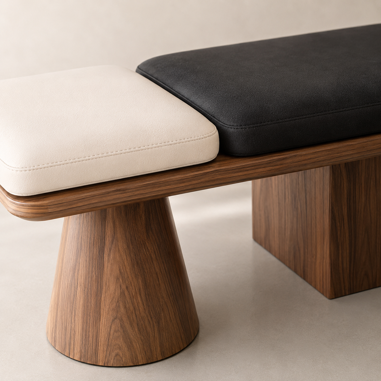 Close view of the cream and black pads meeting on the walnut tray