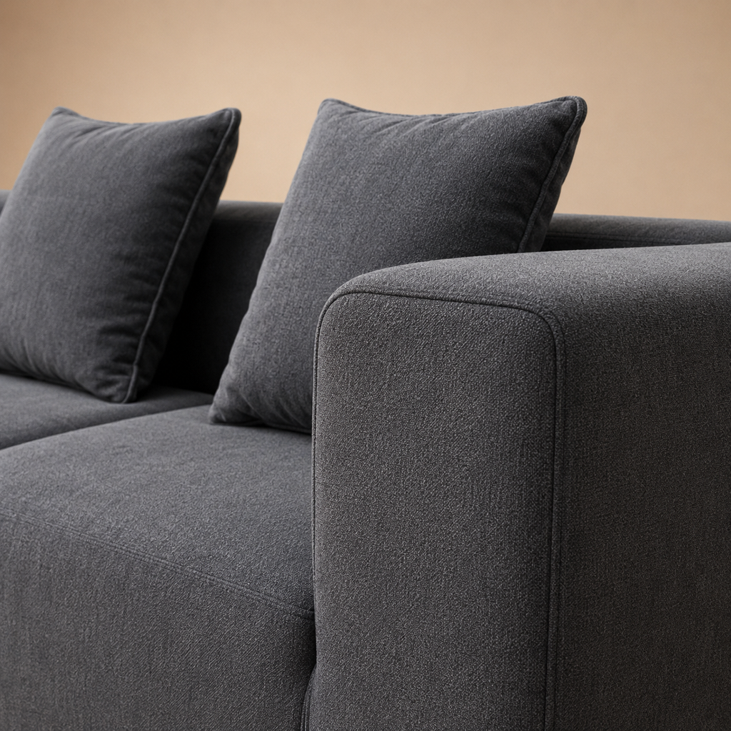 Close view of the Basalte Sofa arm, the rounded corner and the seam where the two modules meet