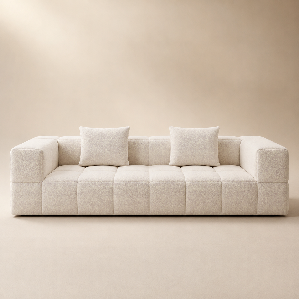 Bulle Sofa in cream bouclé, the seat worked into a grid of puffed squares