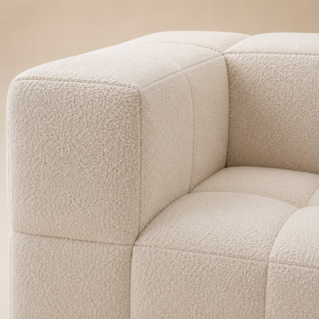 Close view of the Bulle Sofa arm, the grid seams turning the corner onto the flat top