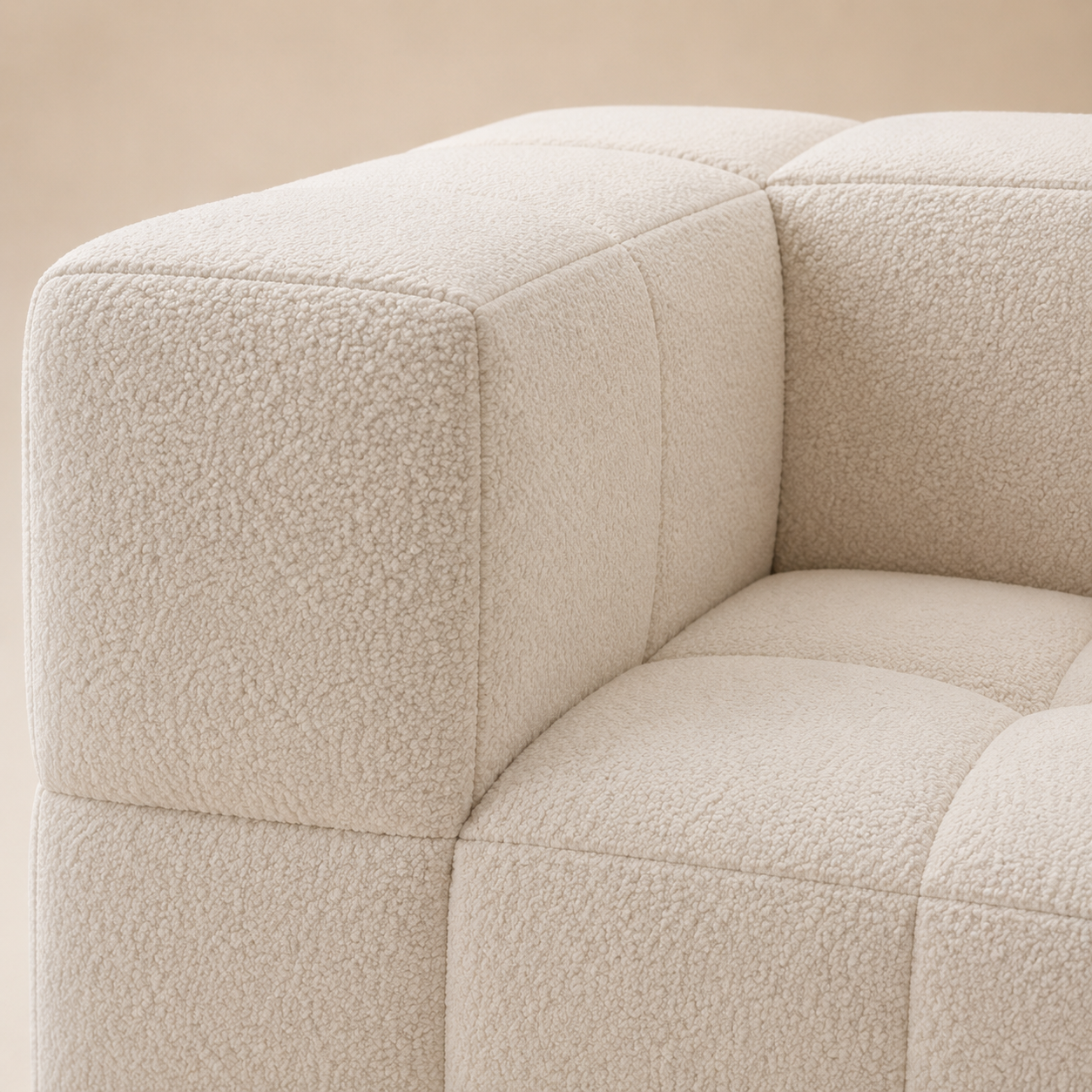 Close view of the Bulle Sofa arm, the grid seams turning the corner onto the flat top