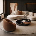 Caillou Armchair in cognac, the wrapped back and arms forming one rounded shell