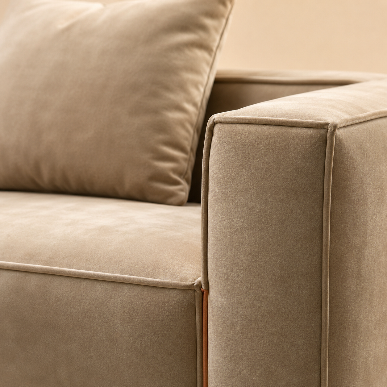 Close view of the Chamois Sofa arm, the cord turning the corner and the tan leather tab below it