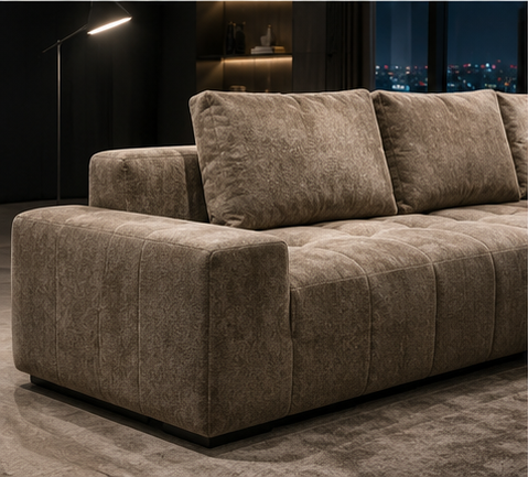 Damier Sofa from the side, the low wide arm and the recessed plinth beneath it