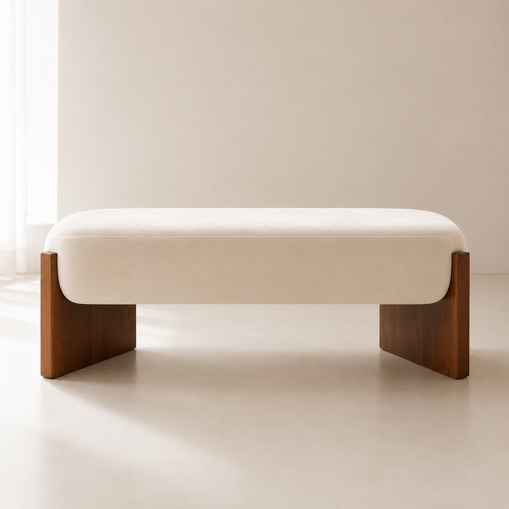 Ecrin Bench in cream, seen in daylight with the slab legs casting a soft shadow