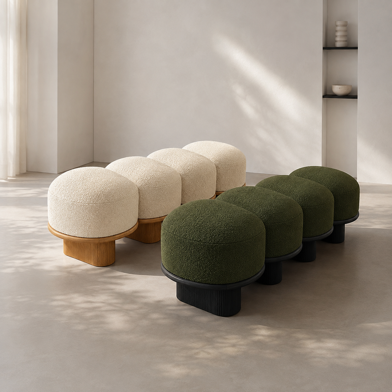 The Galet Bench in cream on oak and in forest on black, side by side in a bright room