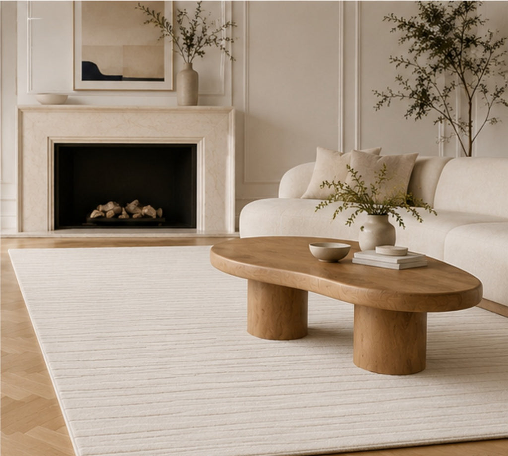 Linéa Rug in a room with a marble fireplace, the relief catching low light