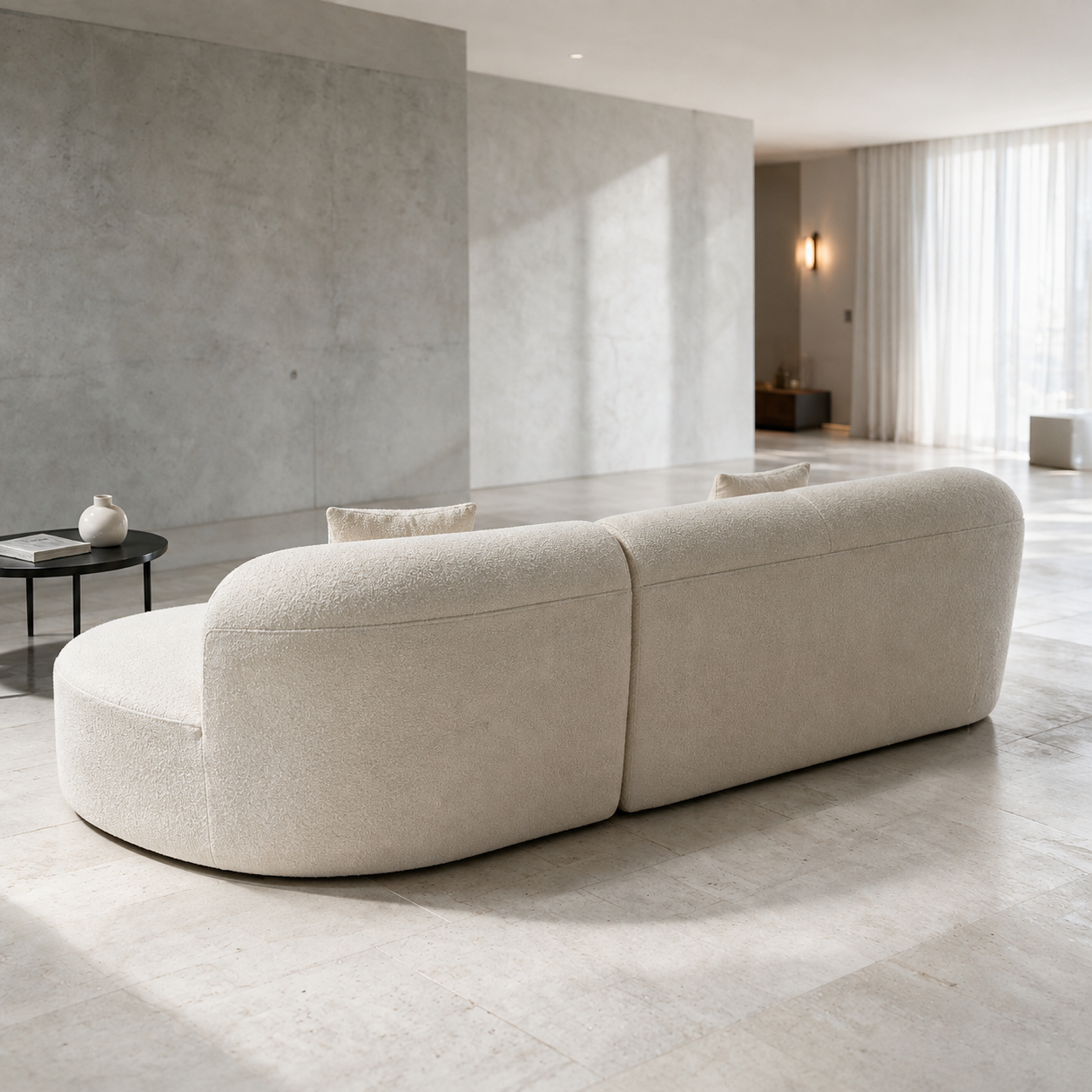 Lune Sofa from behind, the back finished in the same bouclé as the front