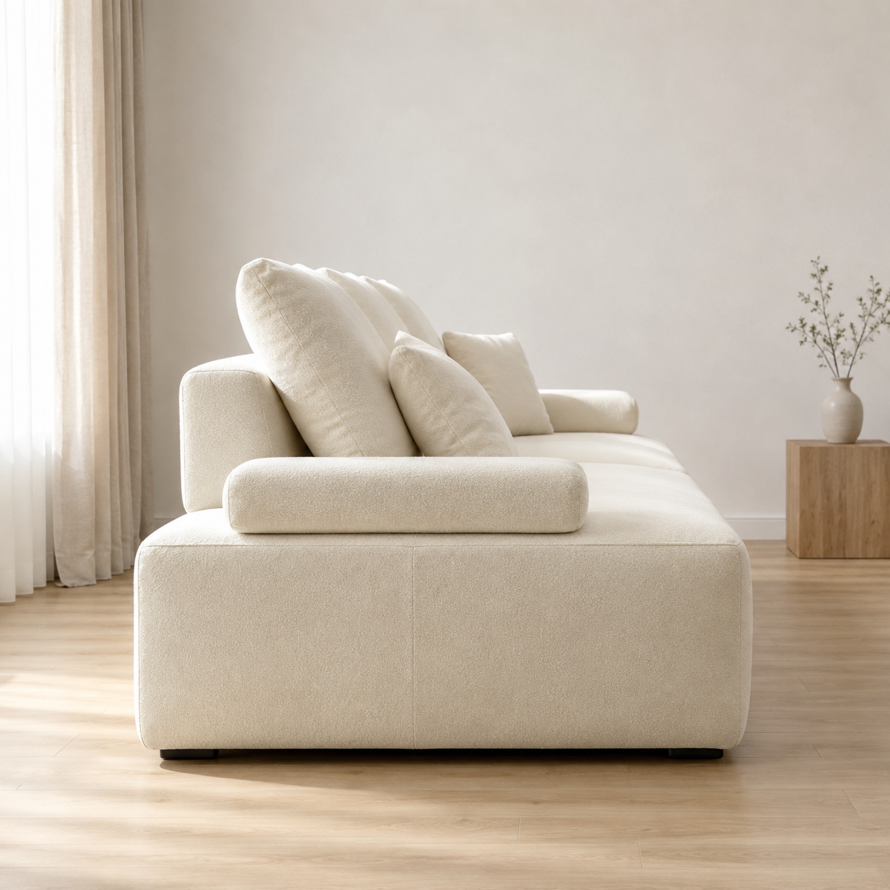 Massif Sofa from the side, the bolster arm resting on the block base