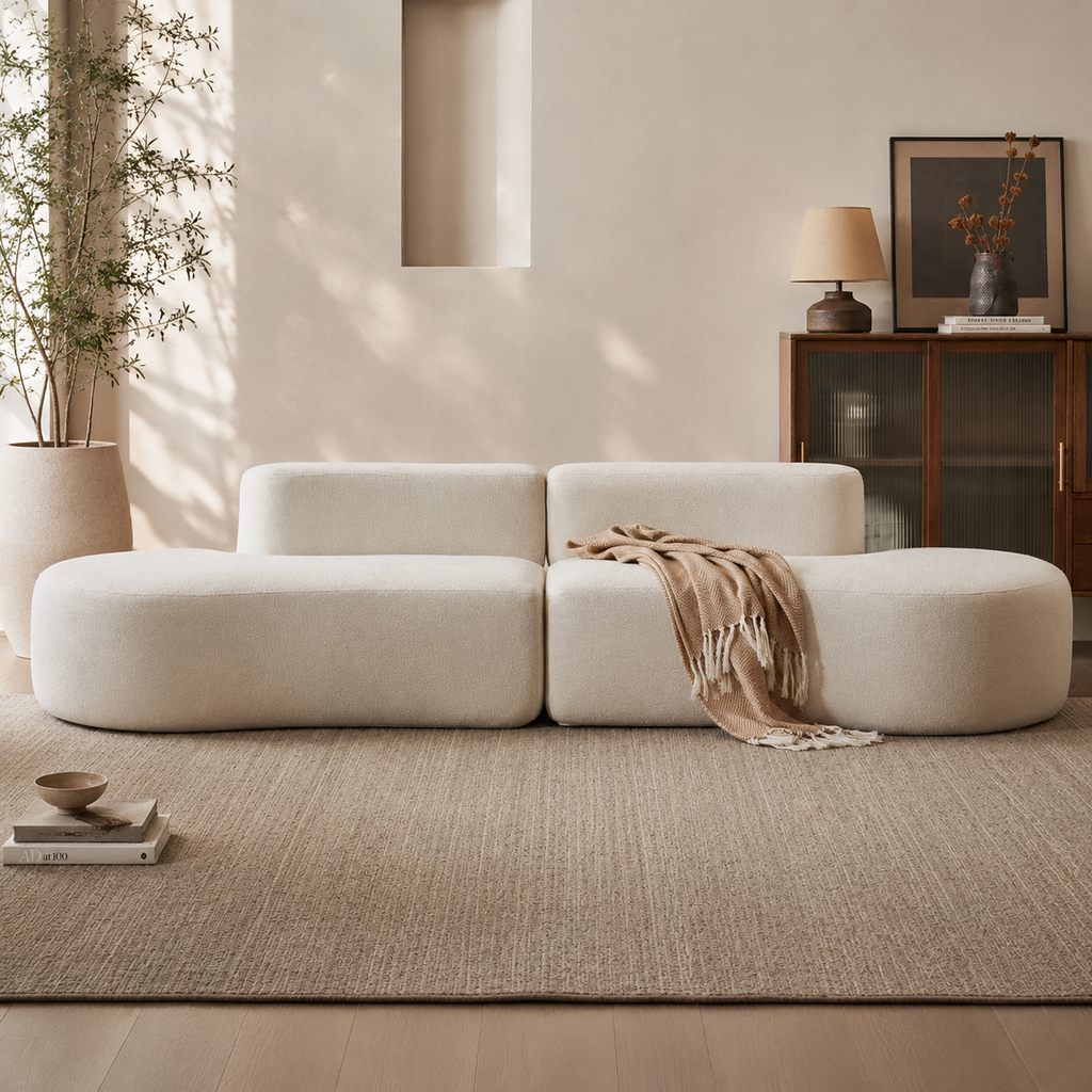 Méandre Sofa in cream bouclé, three curved modules meeting in an S with no arms