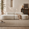 Méandre Sofa in cream bouclé, three curved modules meeting in an S with no arms