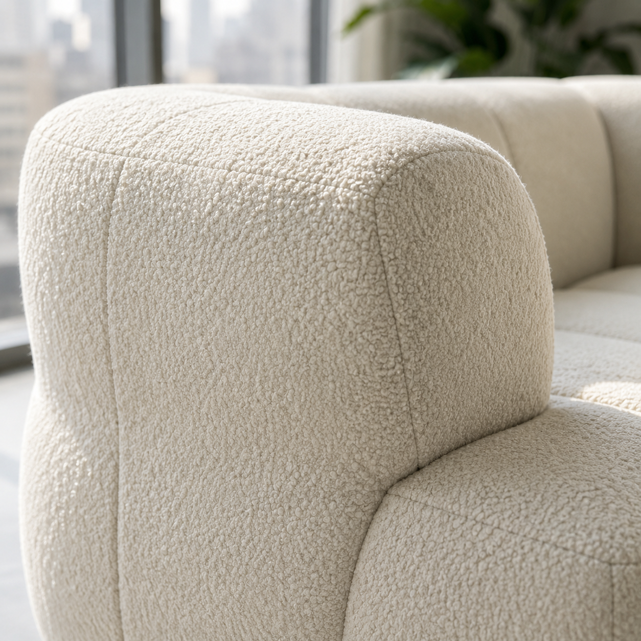 Close view of the Ouate Sofa arm, where the channels curve forward round the end