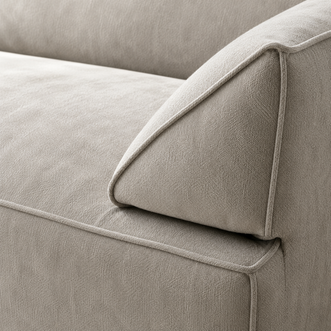 Close view of the Pavé Sofa, the chenille pile and the piped seam along the seat