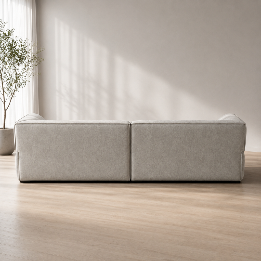 Pavé Sofa from behind, the two modules meeting in a single vertical seam