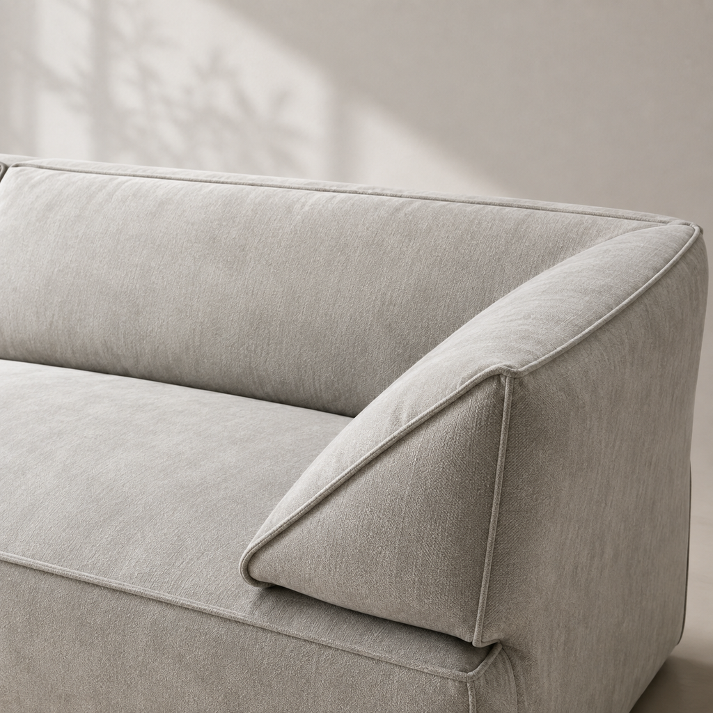 Close view of the Pavé Sofa arm, the cord tracing the wedge where it folds against the back