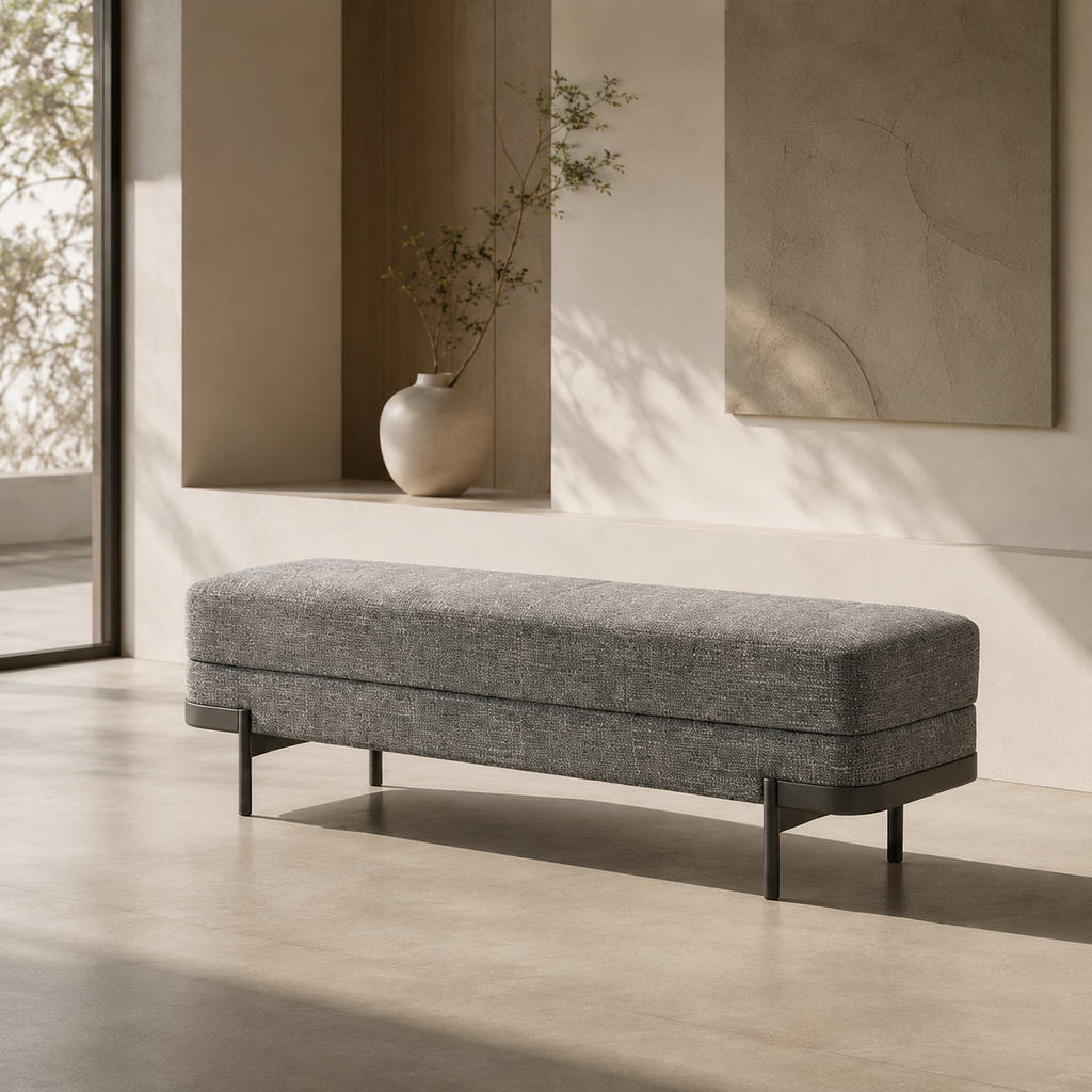 Perrin Bench against a warm plaster wall beside a niche holding a ceramic vase