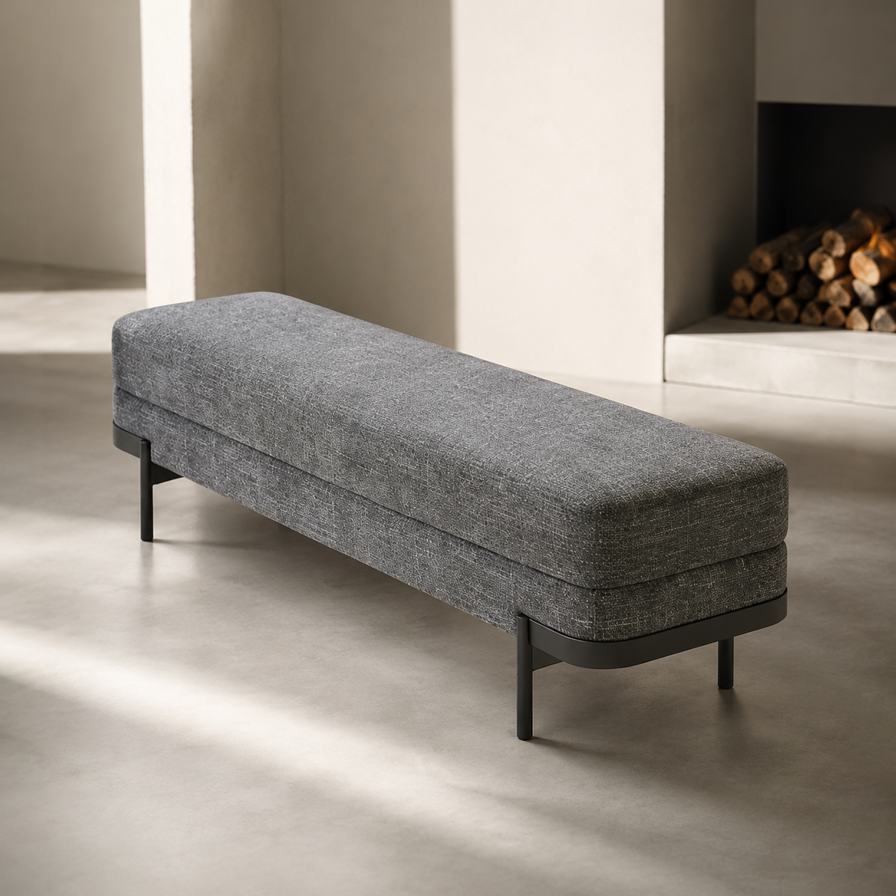 Perrin Bench in afternoon light beside a fireplace with stacked firewood