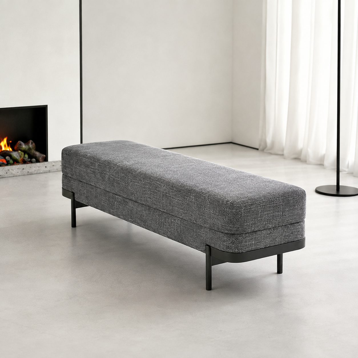 Perrin Bench in a pale room with a fireplace and a slim black floor lamp