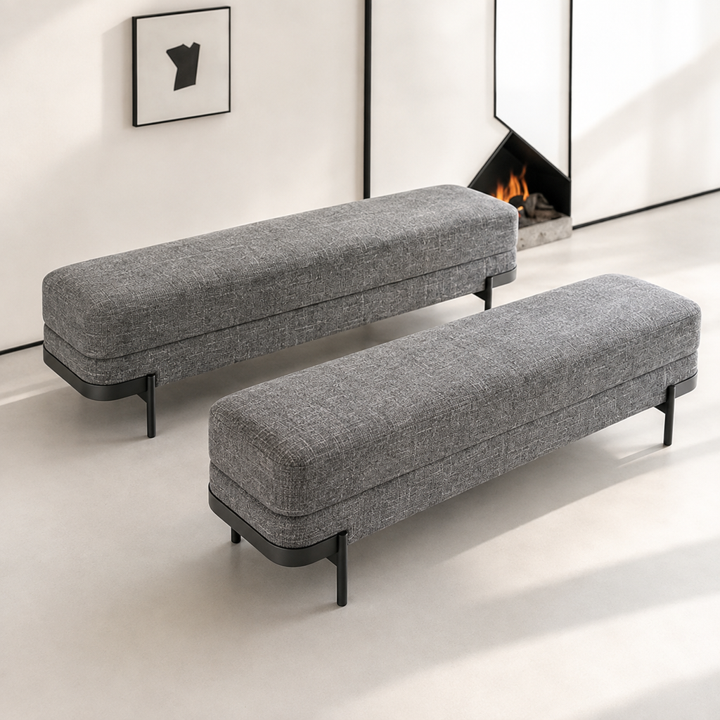 Two Perrin Benches in front of a tall mirror and an open fire