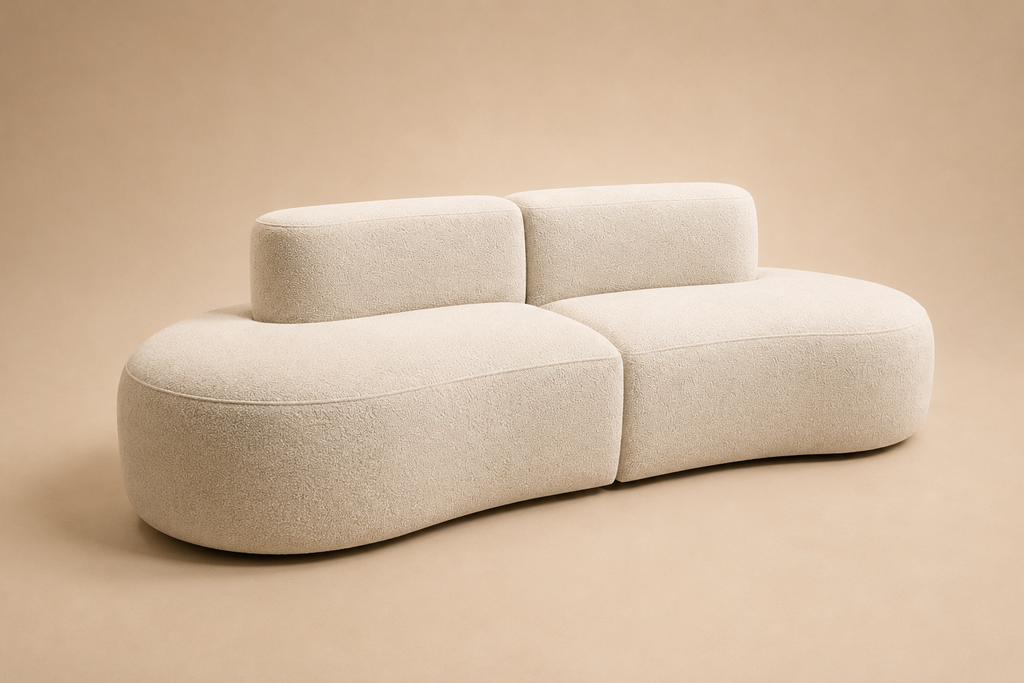 Pétale Sofa in cream bouclé, one curved seat with two low back pads laid on it