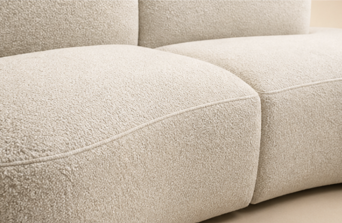 Close view of the Pétale Sofa, the loop of the bouclé where a back pad meets the seat