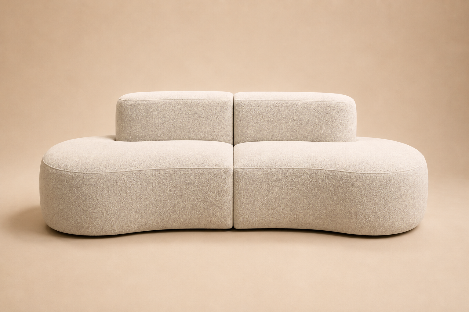 Pétale Sofa seen straight on, the seat sweeping past the back pads into open corners