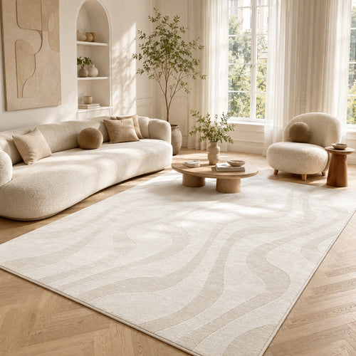 Serein Rug in ivory with carved organic waves, in a sunlit room with a curved boucle sofa