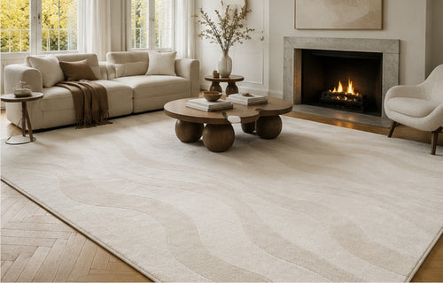 Serein Rug in a panelled room with a marble fireplace and a round wooden coffee table