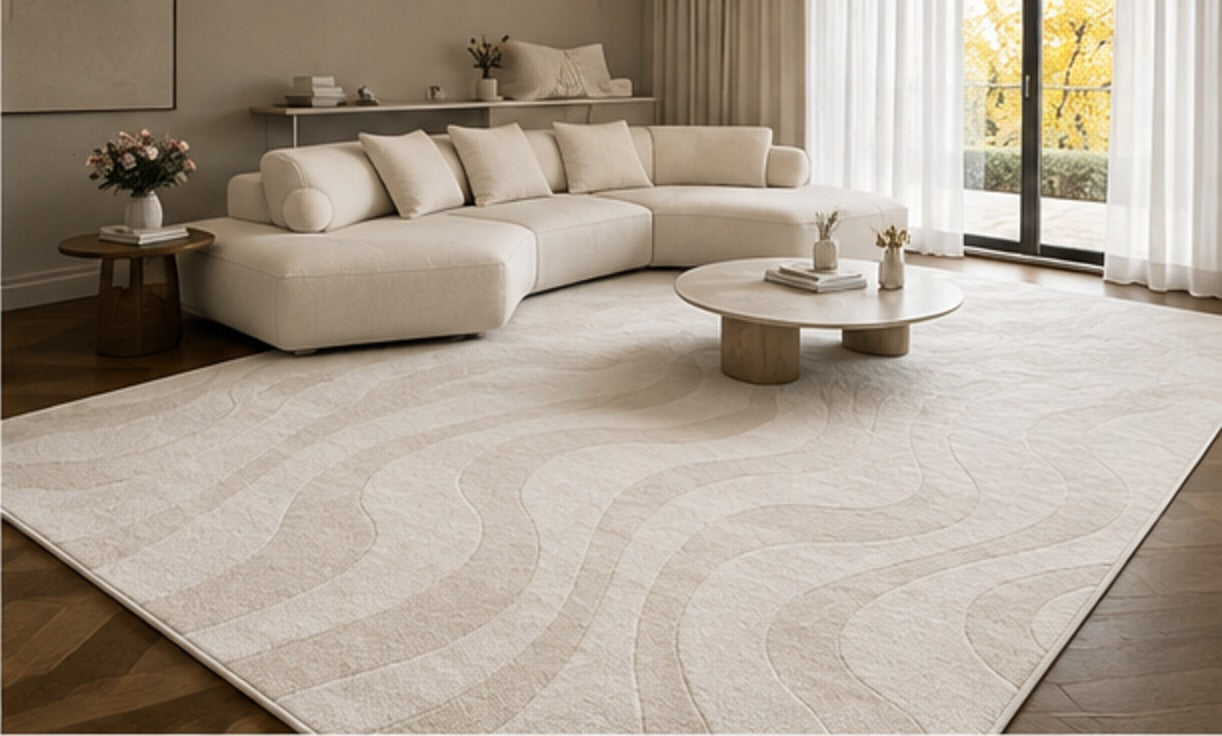 Serein Rug under a long curved sofa, the carved waves running the length of the room