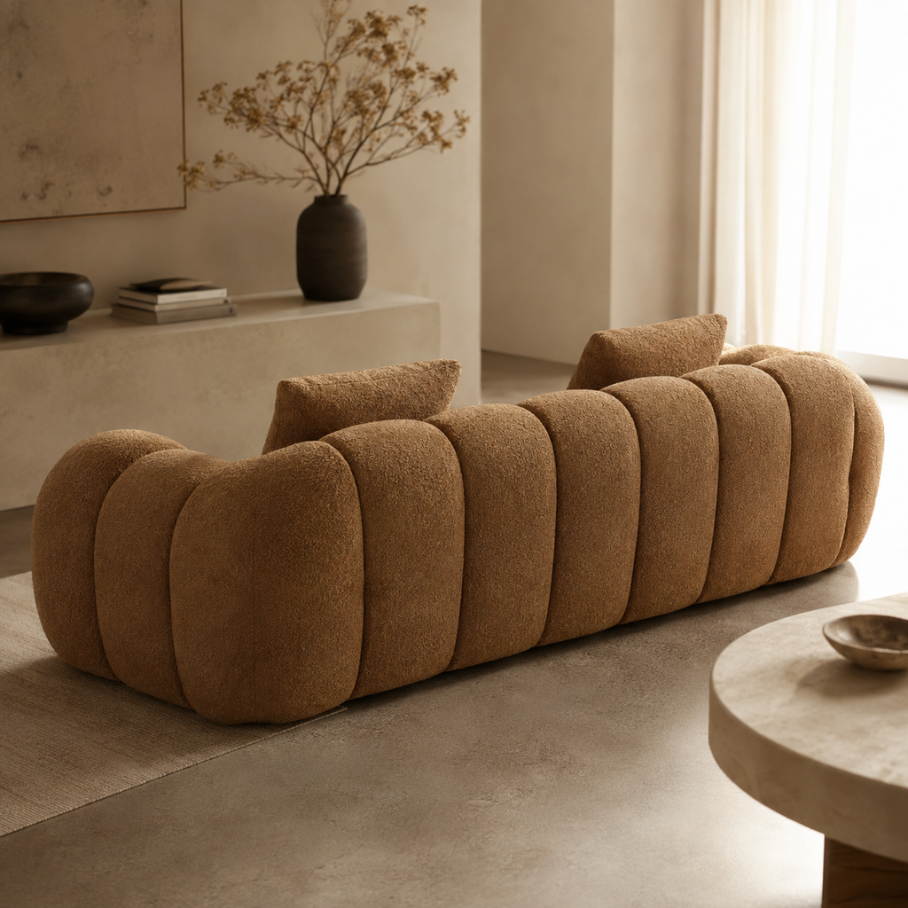 Tonneau Sofa from behind, the back finished in the same channelled bouclé as the front