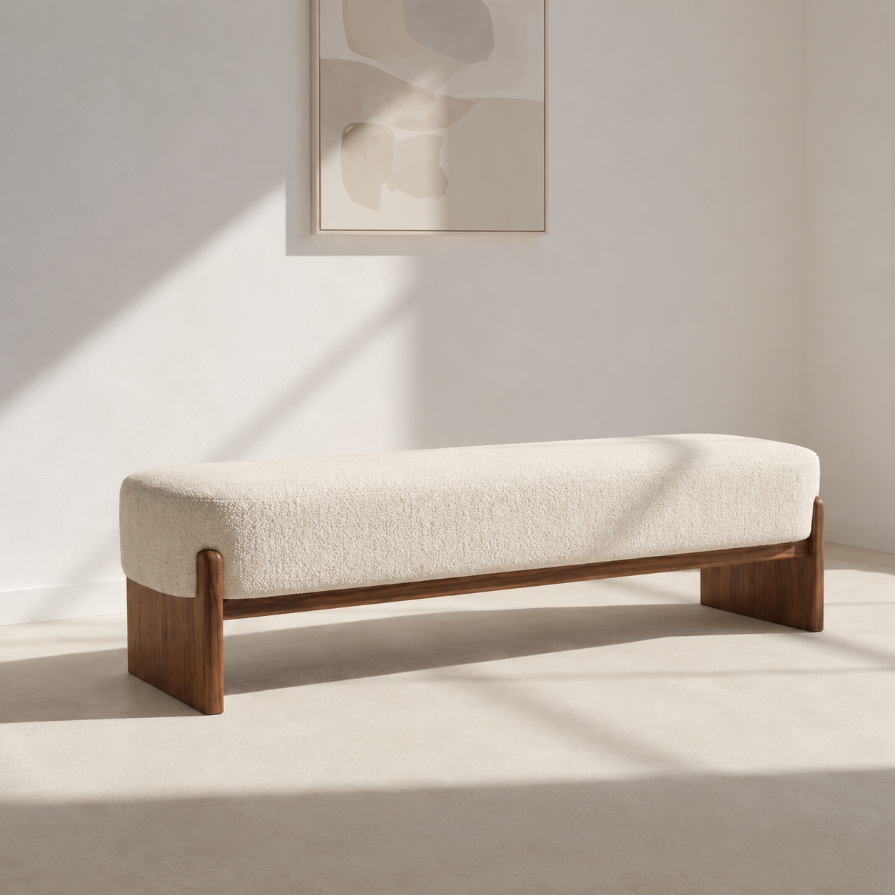 Traverse Bench at an angle in raking sunlight, the flat plank legs and the rail between them