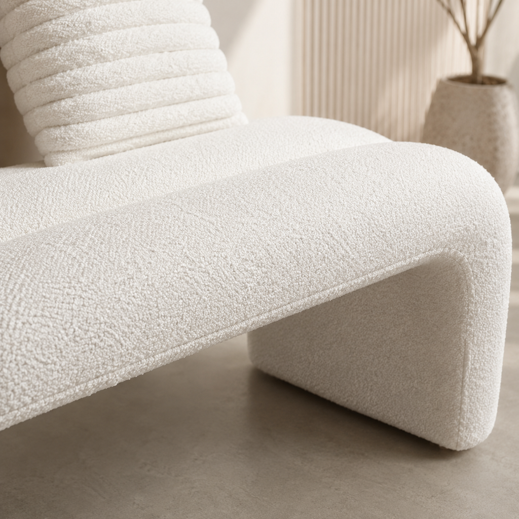Close view of the dense looped weave and the curve where the seat turns down into the leg